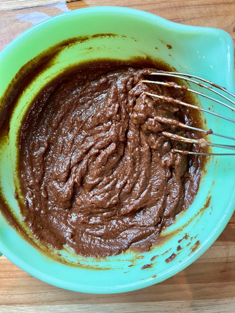 Smooth, thick roux paste in a jadeite mixing bowl after whisking