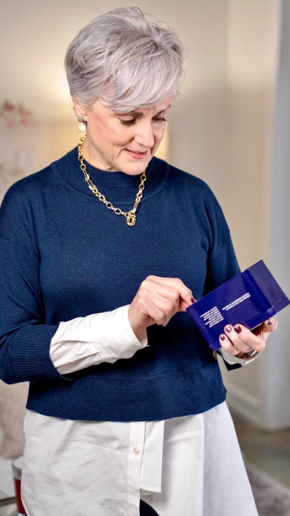 Beth mixing Biologica postmenopause supplement in water — daily effervescent wellness drink for women over 50