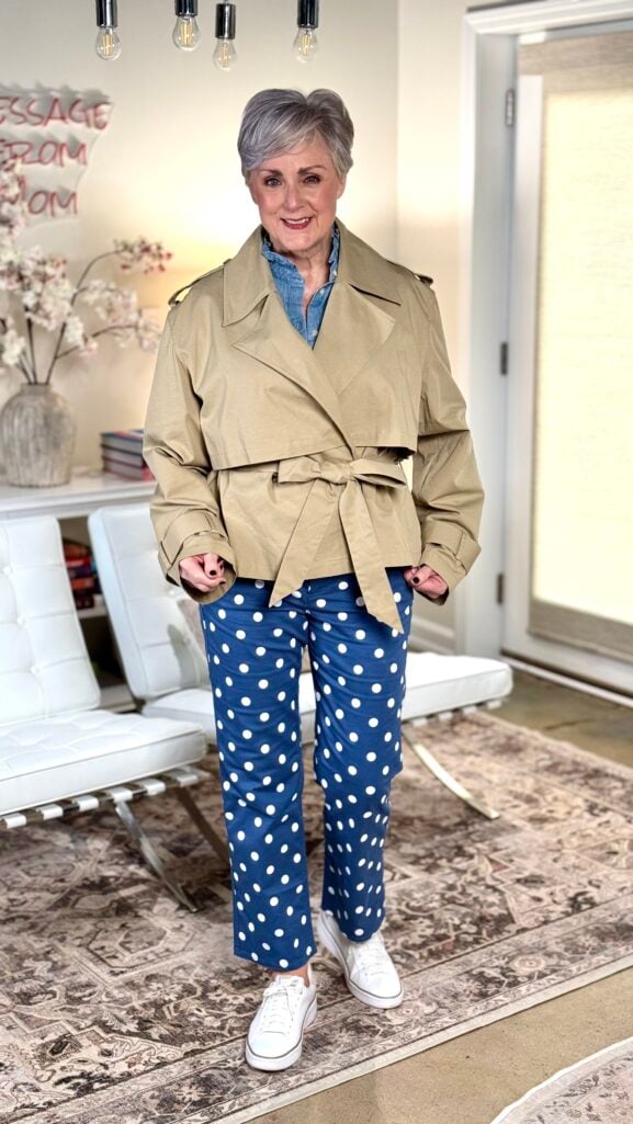 J.Crew Factory chambray ruffle top and polka dot chinos elevated with a cropped trench coat, showing how one investment piece transforms a budget outfit