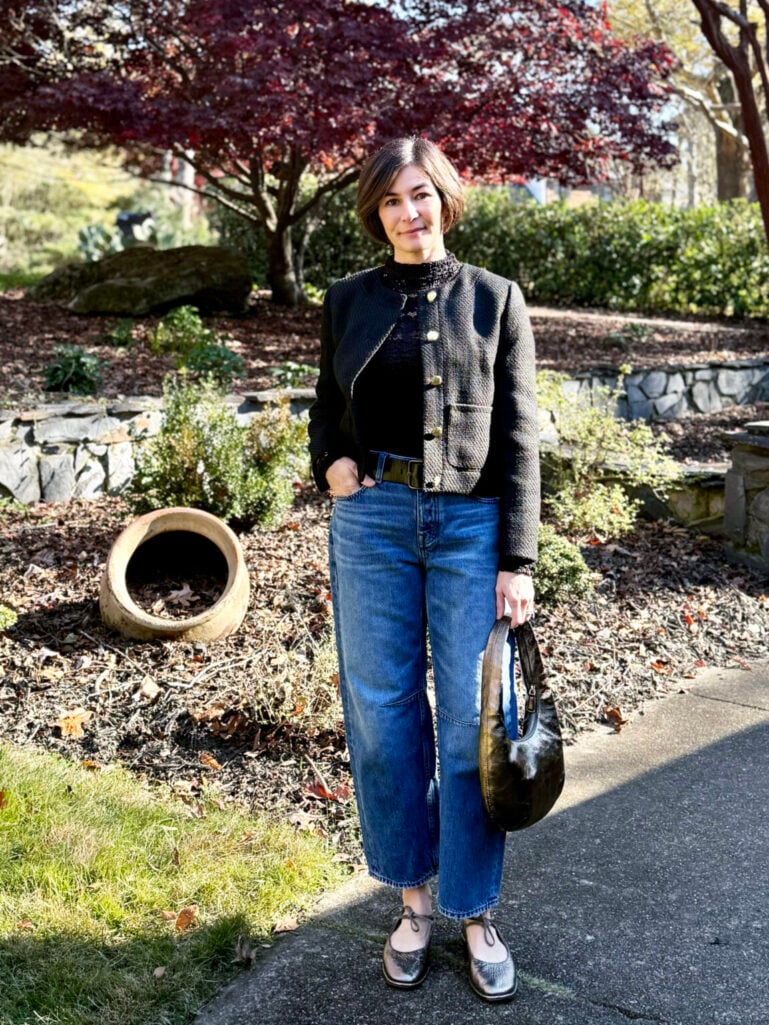 Kelly styling a dark tweed cropped lady jacket with gold buttons over a black top and jeans with metallic ballet flats