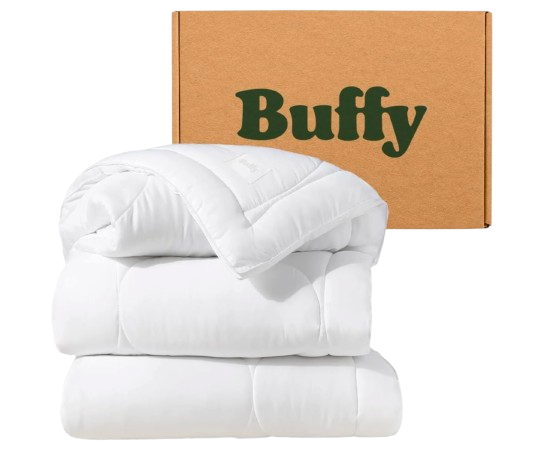 White Buffy Cloud comforter folded in layers, showing plush, quilted construction and lightweight, cloud-like loft.