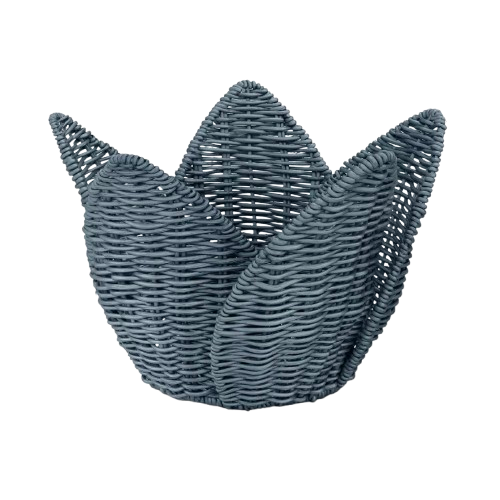 Blue woven wicker basket with sculptural petal-shaped sides, open top, and textured rattan-style weave in a muted slate-blue finish.