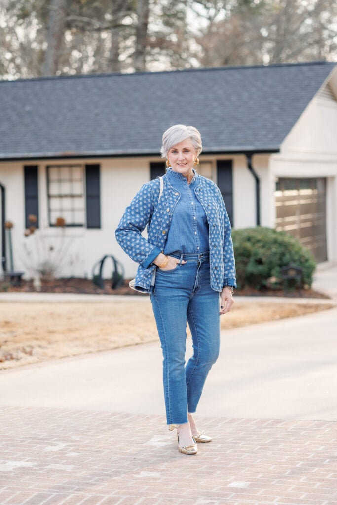 Beth Djalali wearing a quilted pattern jacket and fray hem jeans