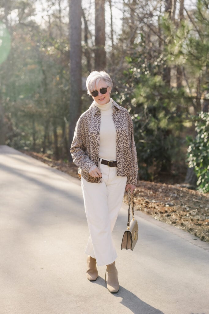 bold pattern for women over 50 — leopard jacket with ivory turtleneck