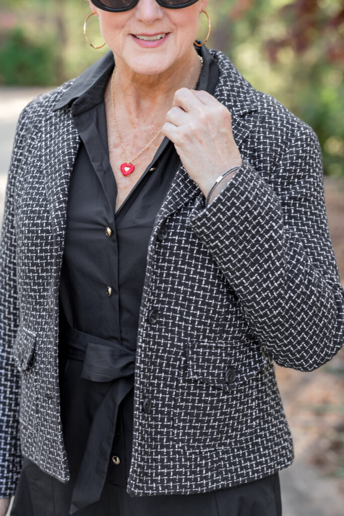 Beth wearing a black tweed blazer over a black midi dress with strappy sandals — spring dress styling for women over 50