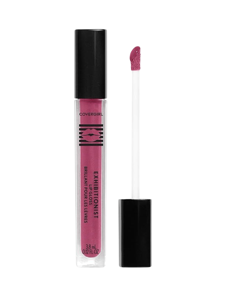 CoverGirl Exhibitionist lip gloss in a berry-pink shade shown open with applicator wand extended beside the clear black-capped tube on a white background — a sheer, juicy spring lip gloss for women over 50.