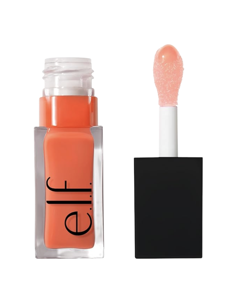 e.l.f. Cosmetics Glow Reviver Lip Oil in a warm peachy-coral shade shown open with applicator wand extended beside the clear orange-tinted square bottle on a white background — a lightweight, glossy lip oil that adds a sheer wash of warm peach color for women over 50.