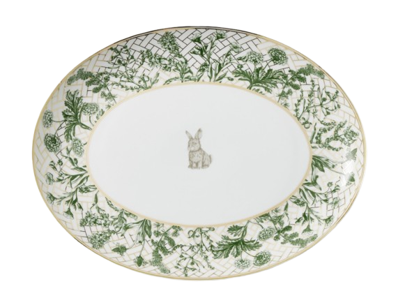 Oval serving platter with a green botanical lattice border and gold trim, featuring a small bunny illustration at the center.