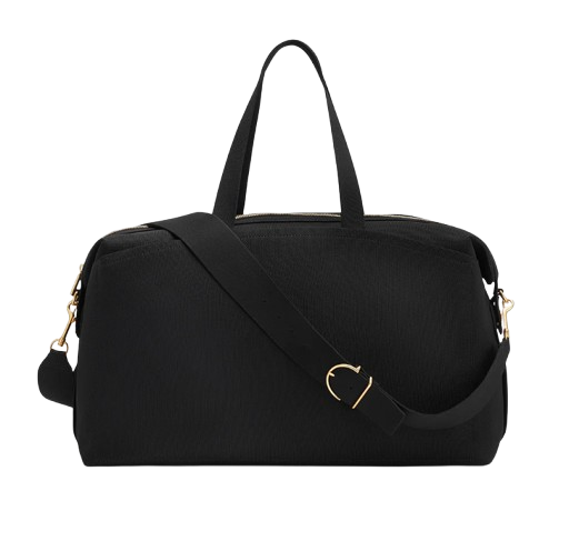 Structured black weekender bag with top handles and a detachable shoulder strap, featuring gold-tone hardware and a spacious zip-top design.