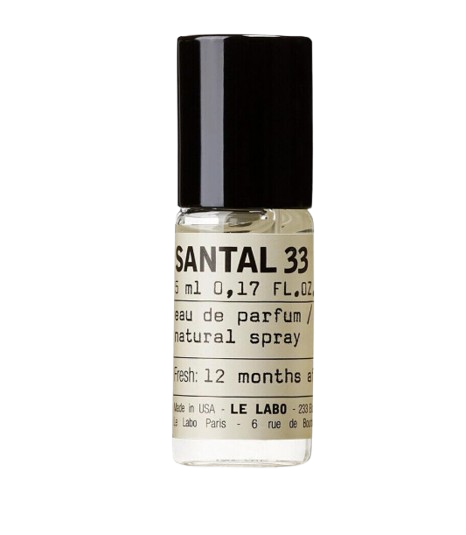 Mini glass spray vial of Le Labo Santal 33 eau de parfum with a minimalist label and black cap, sized perfectly for travel.