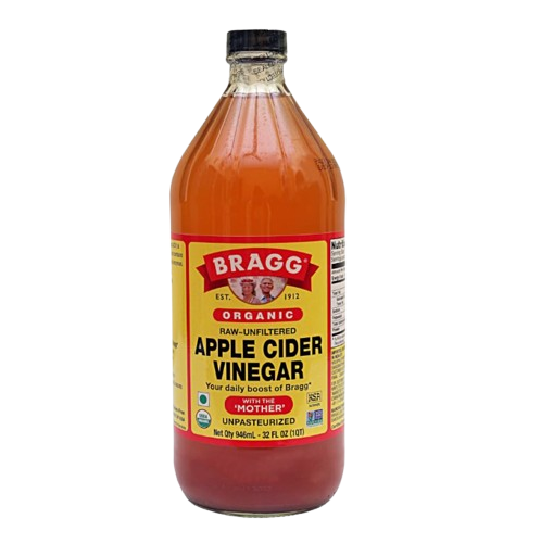 Large glass bottle of amber apple cider vinegar with a yellow and red label, unfiltered and unpasteurized with βthe mother.β
