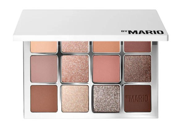 Open eyeshadow palette with 12 neutral shades in matte, shimmer, and metallic finishes, including warm browns, pinks, and champagne tones.