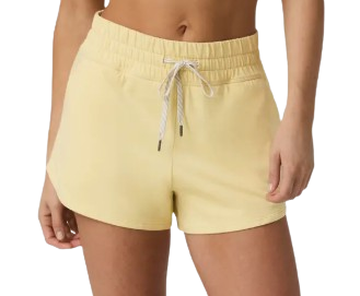 Vuori Halo 2.0 Performance Shorts in Lemon Snap Heather featuring soft yellow fabric, elastic drawstring waistband, relaxed fit, curved hem, and lightweight athleisure design.