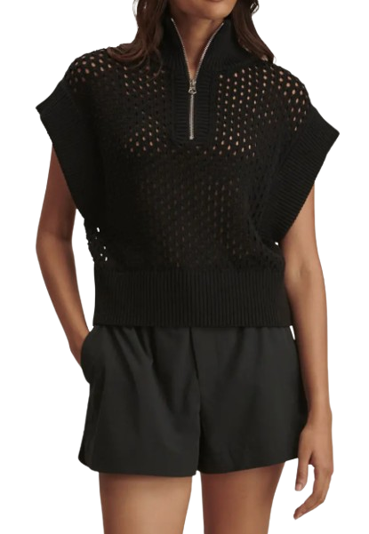 Varley Gaines Half Zip Sweater in black featuring open-knit breathable fabric, relaxed fit, short sleeves, and half-zip collar styled with black athletic shorts for spring layering.