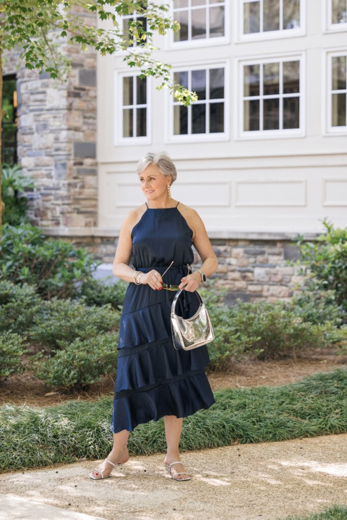 Petal & Pup Anabelle navy halter tiered midi dress for women over 50 — evening cocktail wedding guest outfit