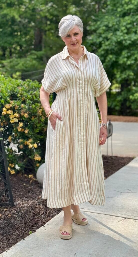 Easy linen dress styled with flat sandals for polished grandmother fashion over 50