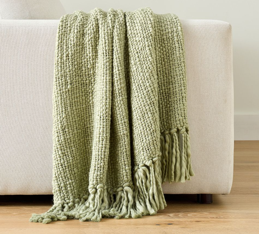 A chunky, textured knit throw that adds warmth, softness, and instant style to any space.