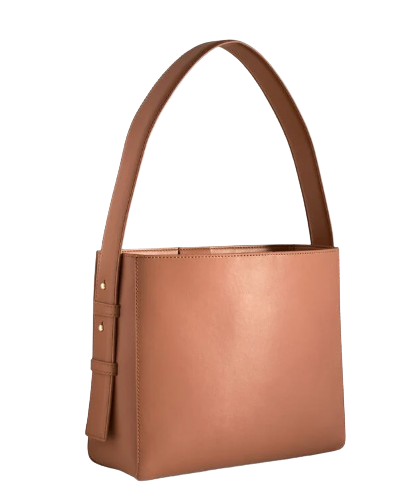 Structured nappa leather bucket bag in warm tan brown with minimalist silhouette, wide shoulder strap, clean lines, and smooth leather finish.
