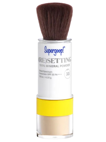 Supergoop! (Re)setting 100% Mineral Powder SPF 35 in portable brush applicator packaging for touch-up sun protection throughout the day.