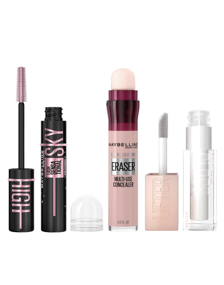 Maybelline Sky High mascara in its black and pink tube with the wand extended, Instant Age Rewind Eraser Multi-Use Concealer in its pink applicator tube, and Lifter Gloss in clear silver pearl with the wand extended, shown side by side on a white background — an affordable three-product makeup bundle and Mother's Day beauty gift available on Amazon for women over 50.