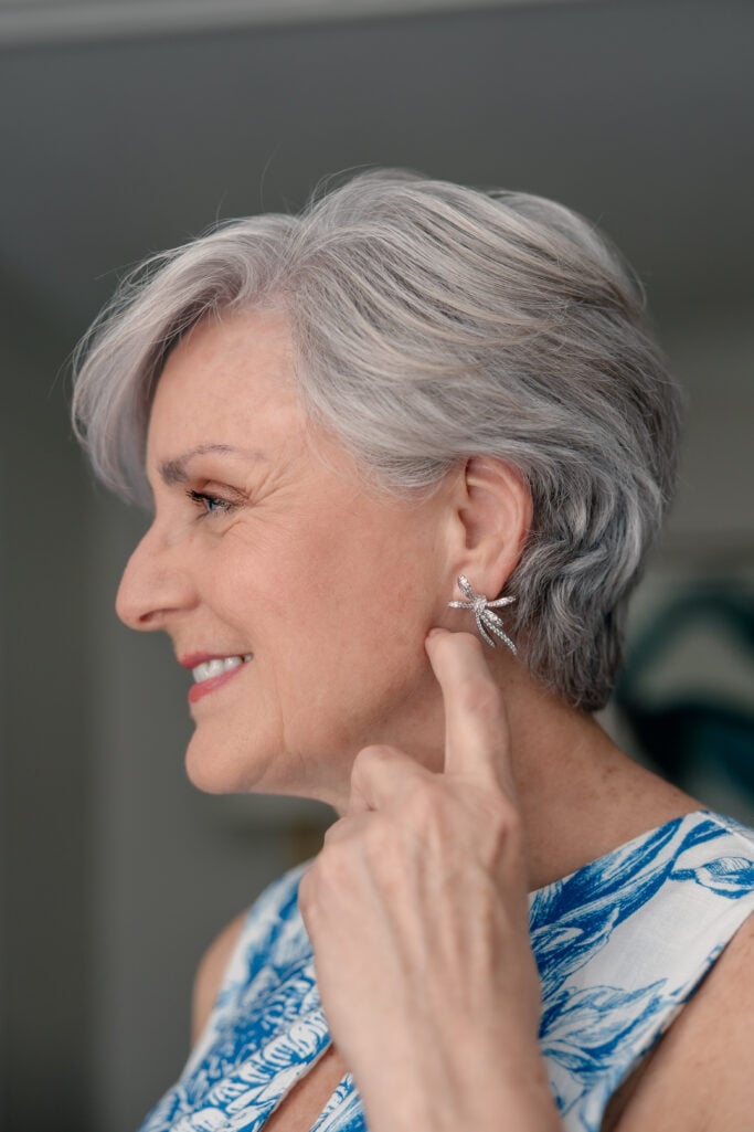 BETH FROM STYLE AT A CERTAIN AGE WEARING BOW STUD EARRINGS
