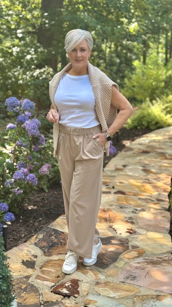 Wide-leg pants, stitch tank, and cardigan — a comfortable travel outfit for women over 50