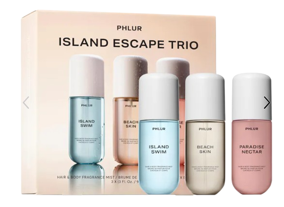 PHLUR Island Escape Trio featuring three travel-size hair and body fragrance mists—Island Swim, Beach Skin, and Paradise Nectar—in pastel bottles inspired by tropical vacations.