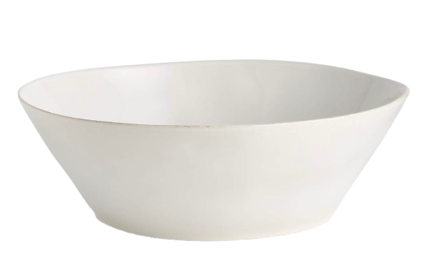 Large white stoneware serving bowl with a clean, minimalist silhouette and subtly speckled finish, ideal for serving salads, pasta dishes, or family-style meals.