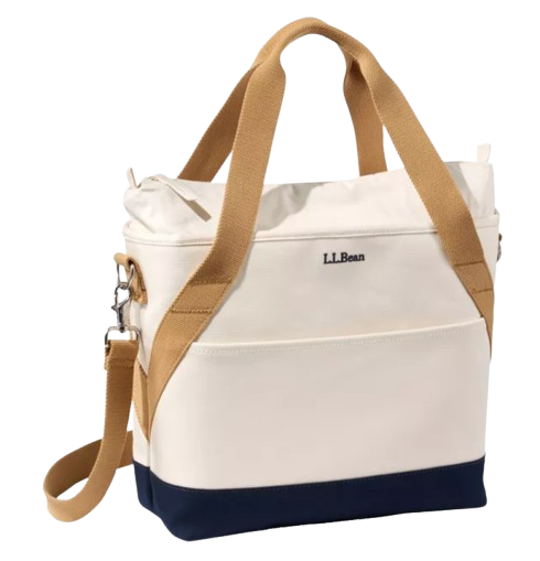 Insulated L.L.Bean soft-sided cooler bag with cream canvas construction, navy accents, and sturdy carrying straps for transporting food and drinks to picnics, beach days, and outdoor events.