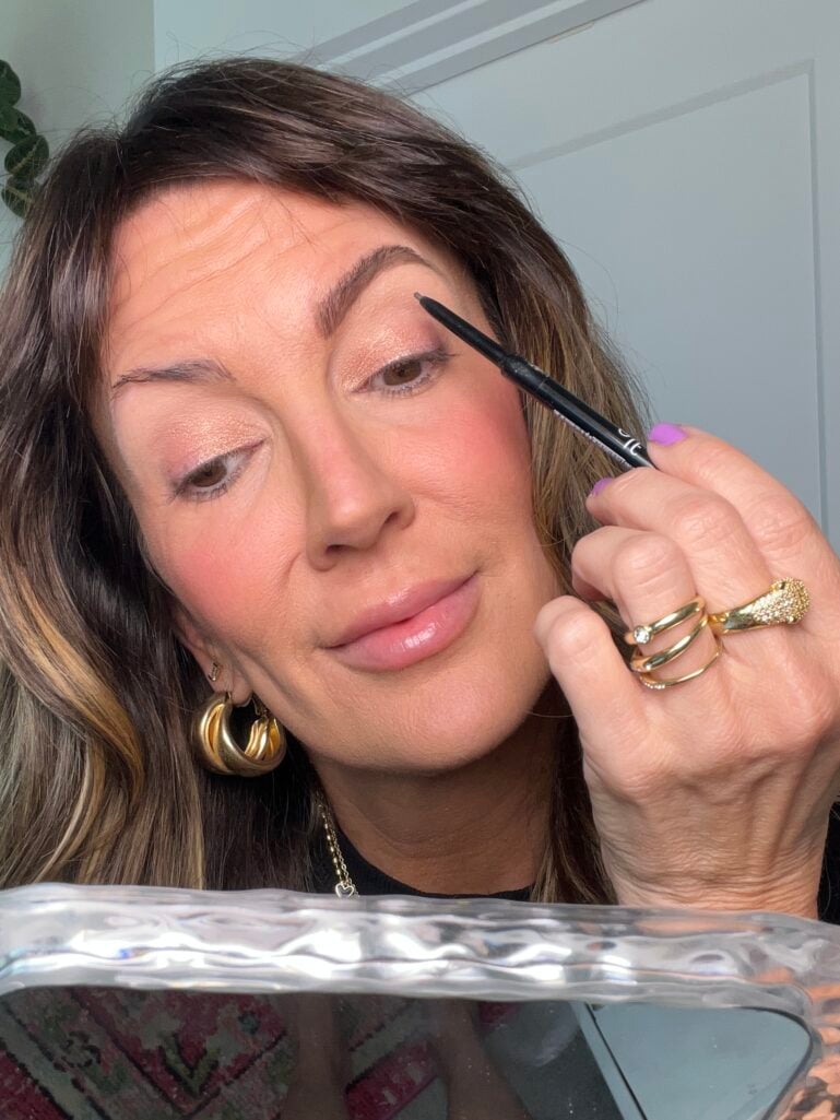 e.l.f. Ultra Precise brow pencil applied on a woman over 50