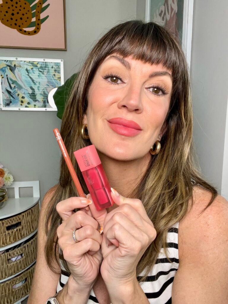 Peachy coral lipstick over 50 — Maybelline Teddy Tint in Petalcore swatch