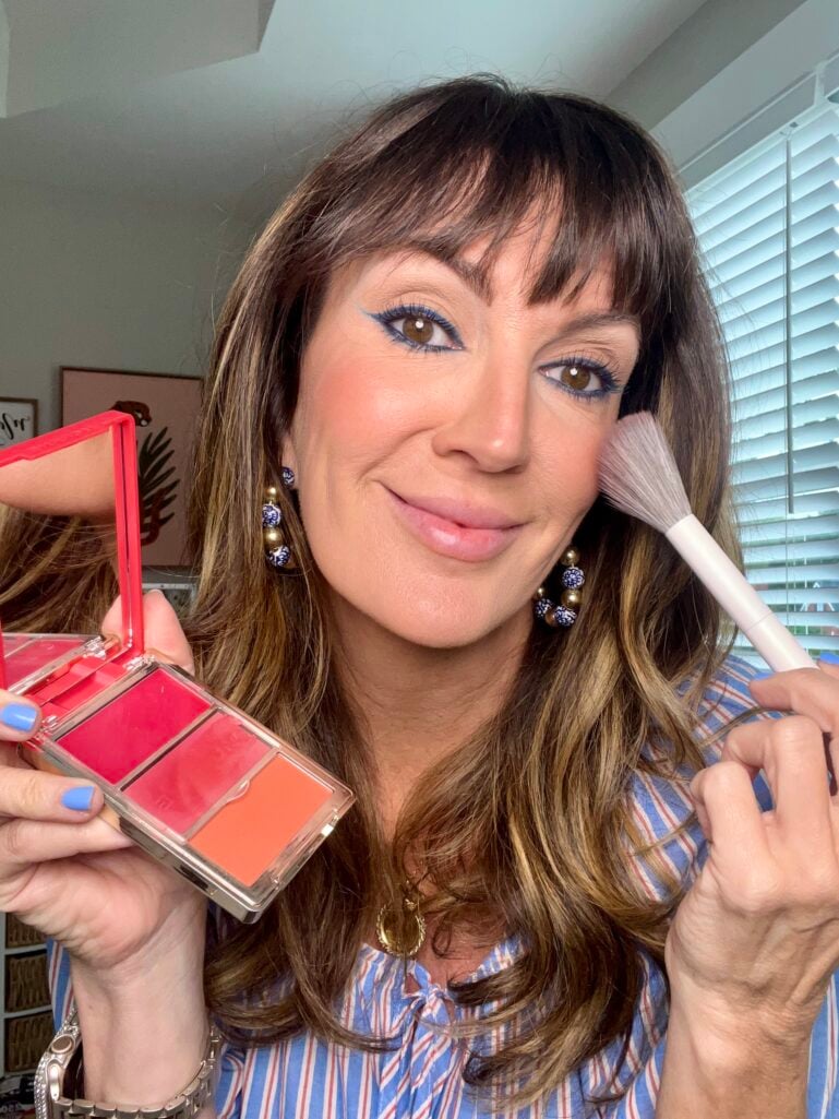 Rosy-red blush applied for a healthy flush on mature skin