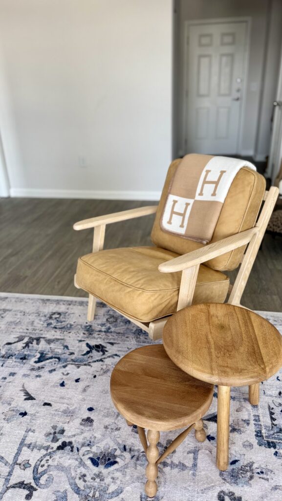 Camel leather chair in Atlanta apartment living room