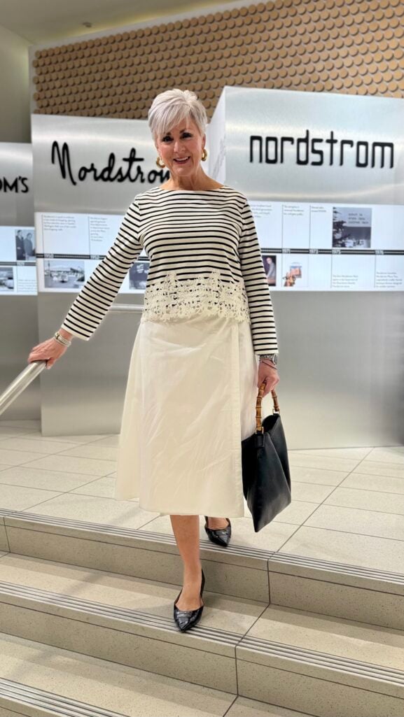 Beth Djalali at the Nordstrom YouTube event in New York wearing a Breton stripe lace-hem top, white midi skirt, and bamboo-handle bag