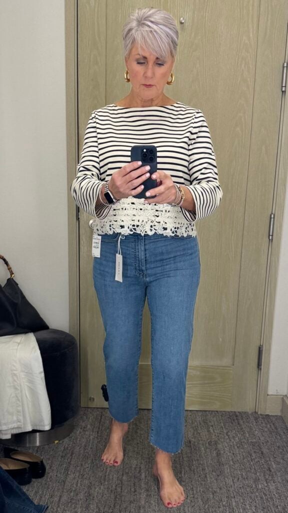 Frame Pixie Le Sleek Straight: Woman over 50 wearing Frame Pixie straight-leg jeans, one of the best fall jeans for women over 50