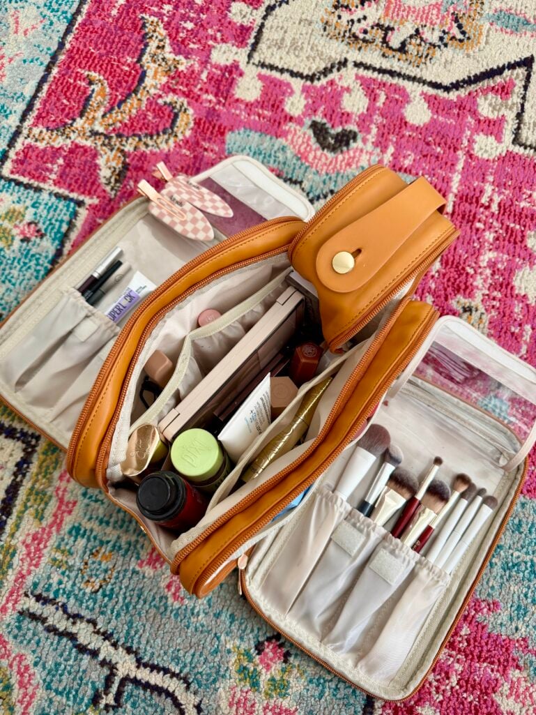 travel makeup bag essentials shown open with brush compartments