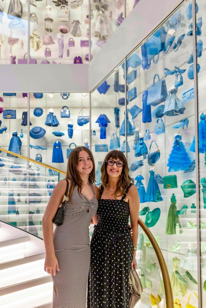 mother and daughter on the steps of Le Galerie Dior in Paris
