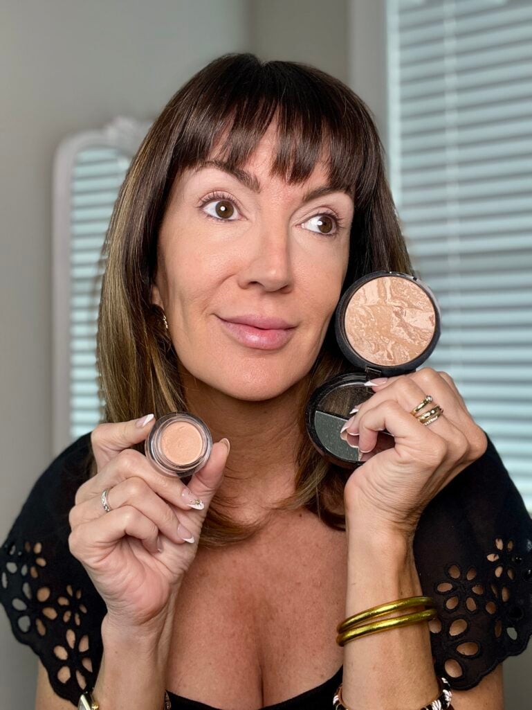 Wearing Laura Geller baked foundation with concealer for natural coverage