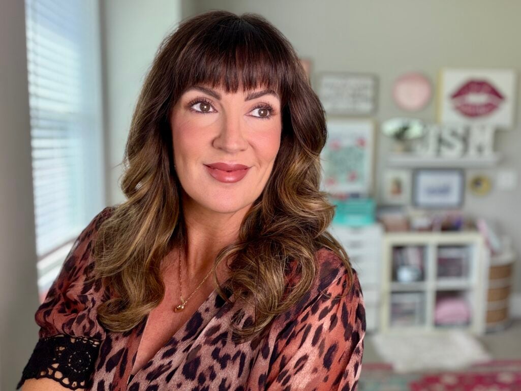 Finished makeup look on mature skin, wearing a leopard print blouse