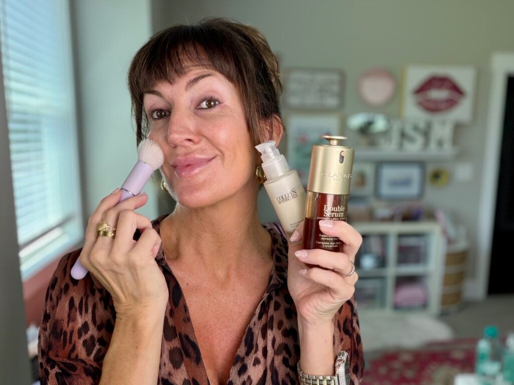 Layering serum and moisturizer with a skincare brush for mature skin