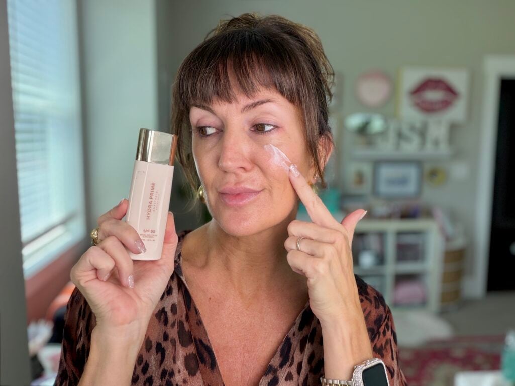 Applying Anastasia Beverly Hills Hydra Prime SPF 50 primer under the eye