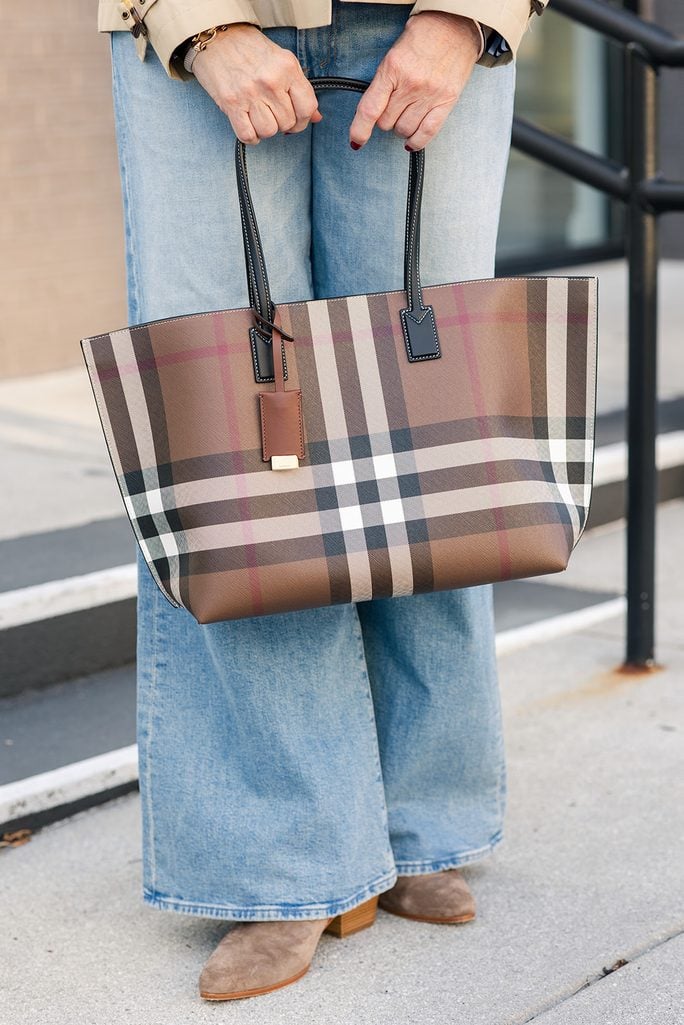 Fall accessories with a Burberry plaid tote, sunglasses and gold teardrop earrings