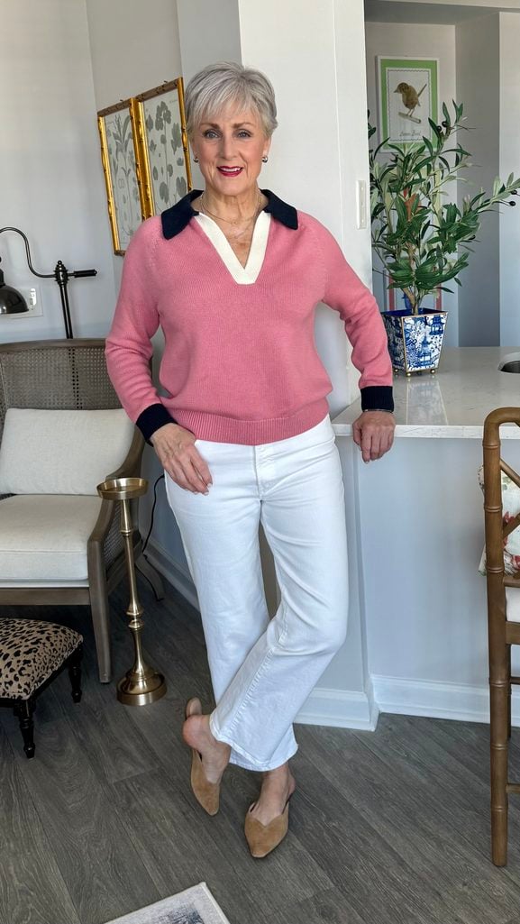 Beth wearing white jeans with a rose pink collared sweater and tan suede mules for an early fall outfit