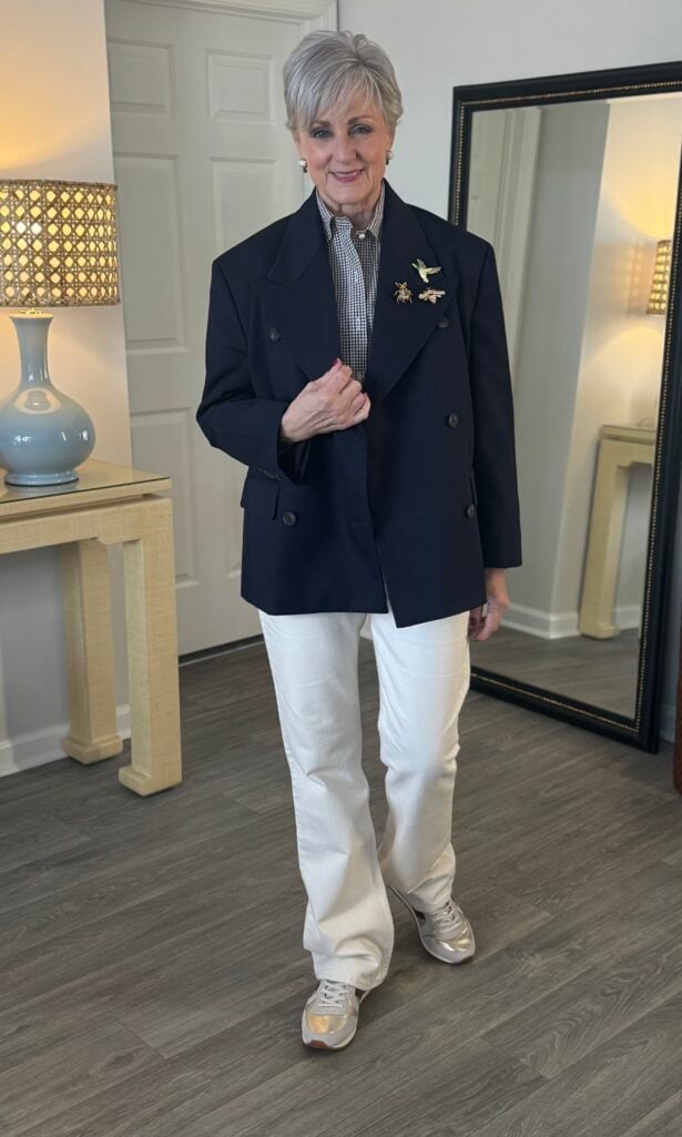 Slim straight ankle jeans with an oversized blazer and sneakers.