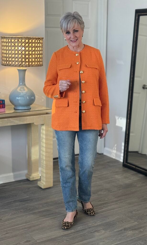 Slim straight ankle jeans with an oversized blazer and sneakers.