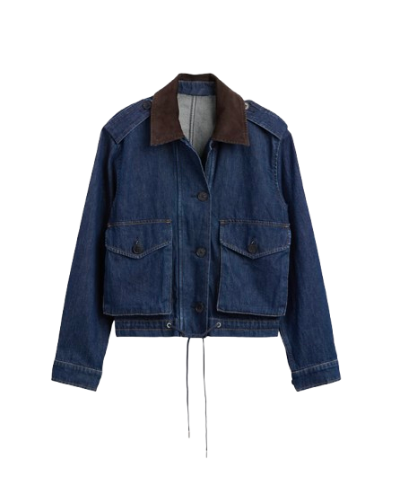 Jean jacket with a brown corduroy collar worn over white jeans.