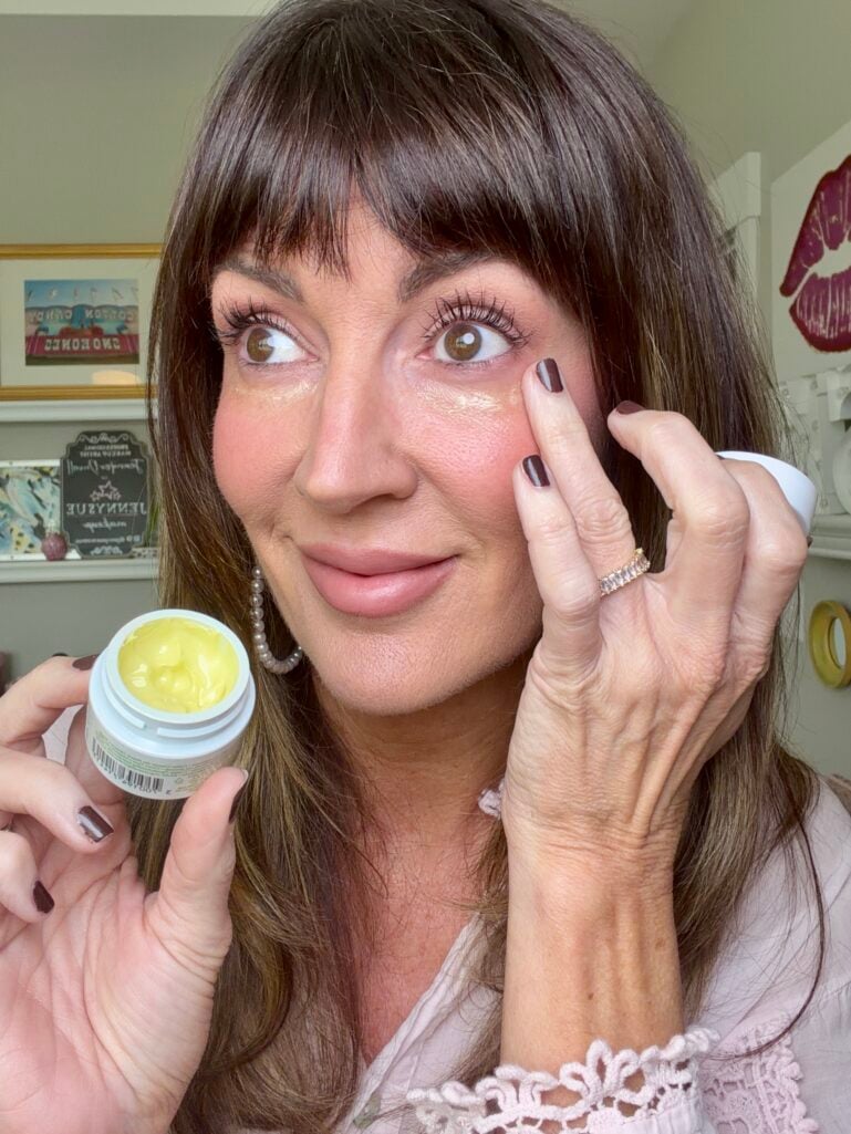 Pressing Kiehl's avocado eye cream under the eyes before makeup