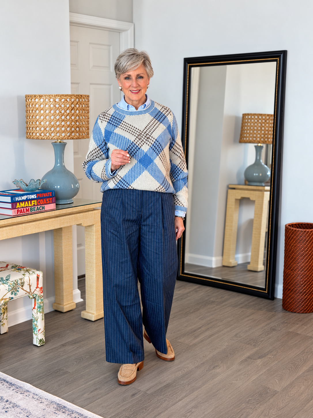 Pinstripe wide leg pants with a plaid crewneck sweater over a denim shirt
