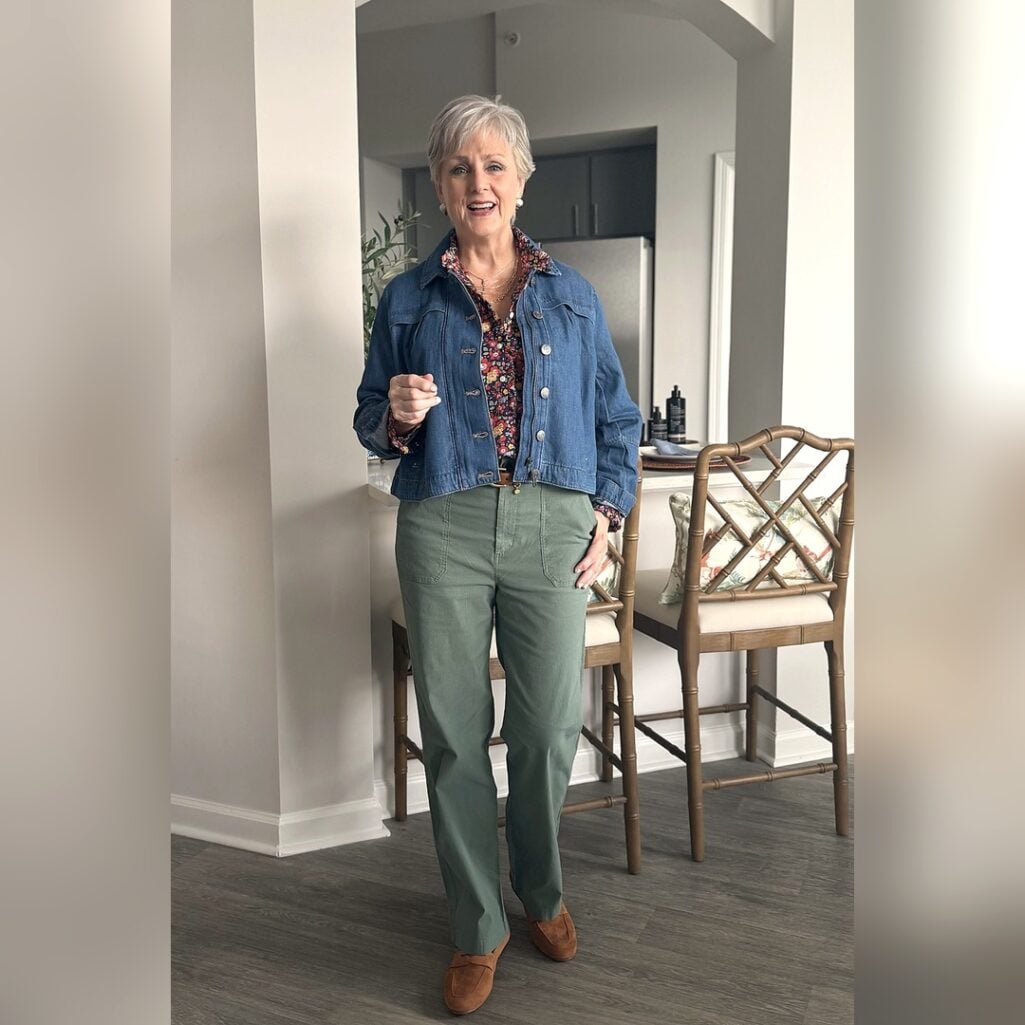 Beth in Liberty print shirt, denim jacket and green chinos