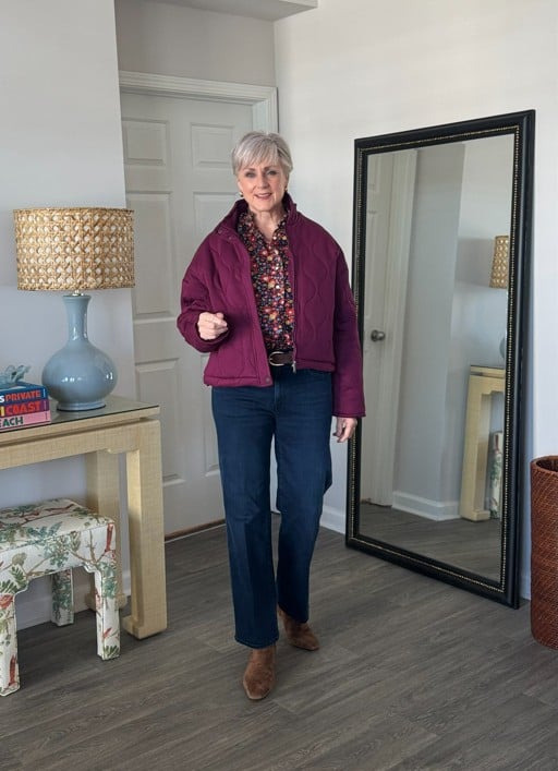 Beth in plum quilted jacket, floral frill blouse, dark jeans, suede ankle boots